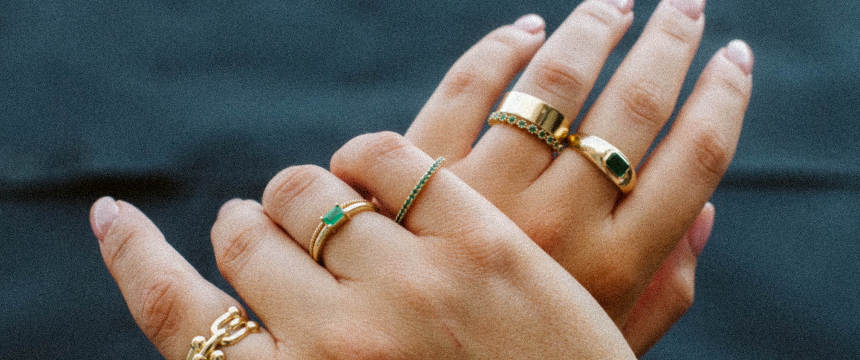 Yellow gold and emerald stacking rings