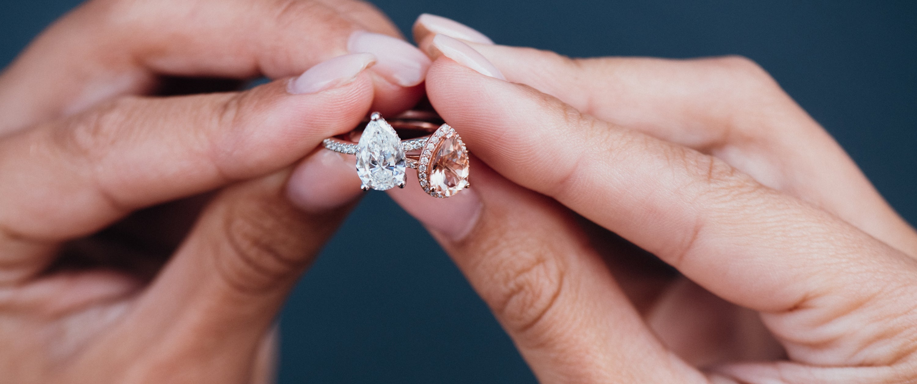 Close Up of Morganite and Diamond Pear Engagement Rings