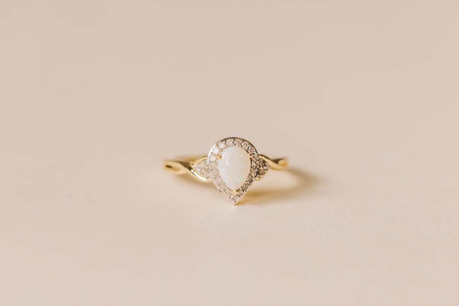 Halo Ring with .17 Carat TW of Diamonds and 7x5MM Pear Shape Opal in 10kt Yellow Gold