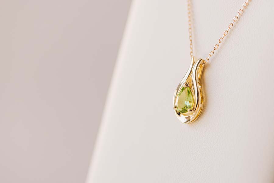 Pendant with 7x5MM Pear Shape Peridot in 10kt Yellow Gold with Chain