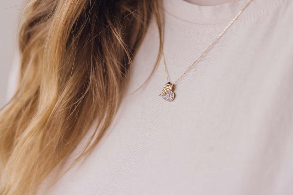 Heart Shaped Wing Pendant with .16 Carat TW of Diamonds in 10kt Yellow Gold