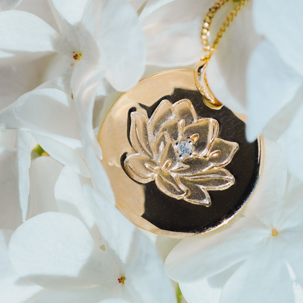 15MM Asian Heritage Lotus Disc Pendant with .01 Carat Diamond in 10kt Yellow Gold with Chain