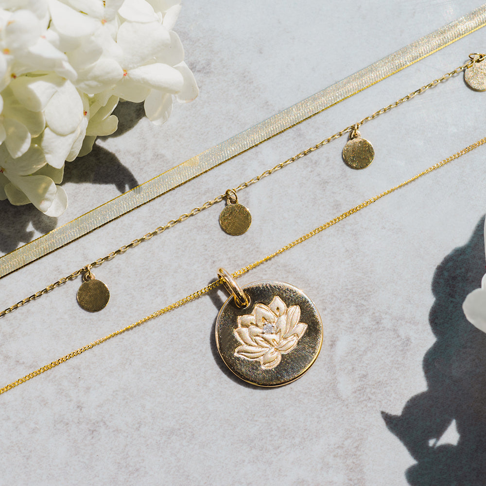 15MM Asian Heritage Lotus Disc Pendant with .01 Carat Diamond in 10kt Yellow Gold with Chain