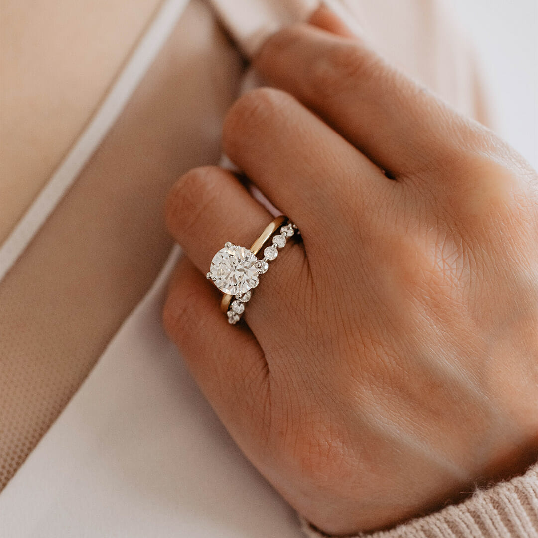 Eternal Shared Prong Wedding Band with .50 Carat Round Brilliant Diamonds in 18kt White Gold