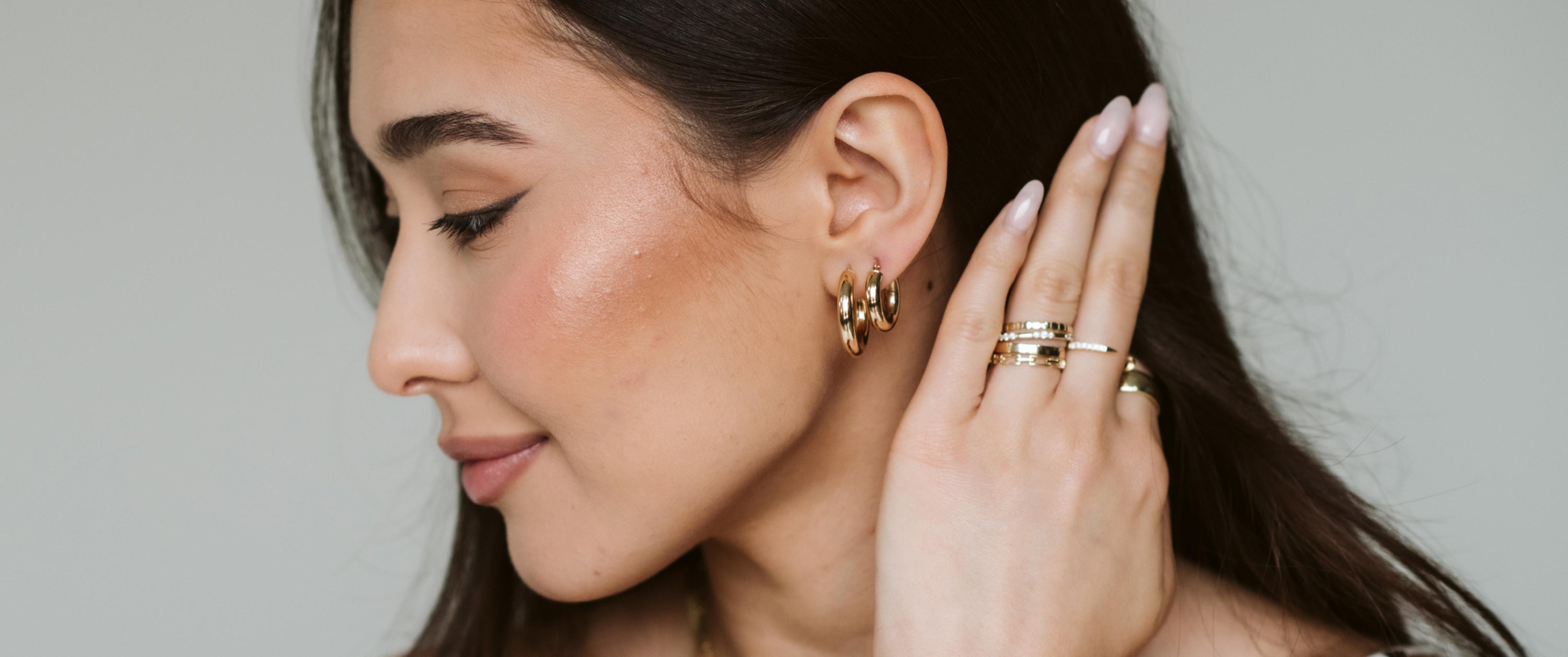 Close Up Woman with Yellow Gold Hoop Earrings