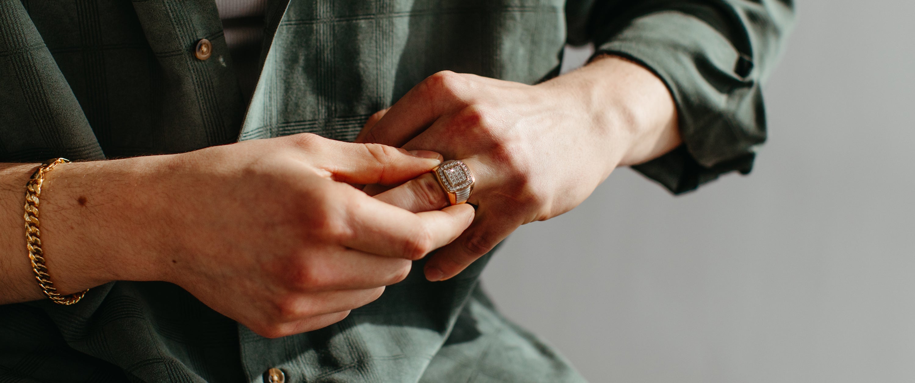 Man wearing diamond wedding band.