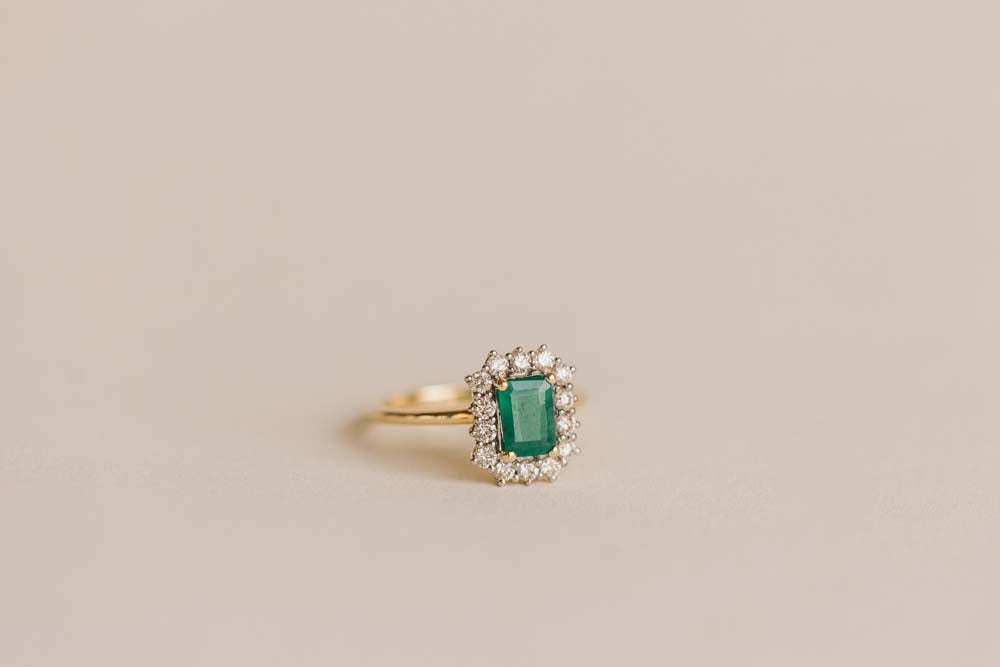 Ring with 7X5MM Emerald Cut Emerald and .45 Carat TW of Diamonds in 14kt Yellow Gold