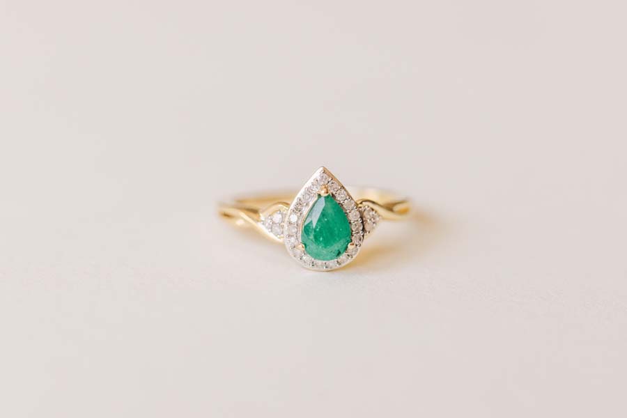 Halo Ring with .17 Carat TW of Diamonds and 7x5MM Pear Shape Emerald in 10kt Yellow Gold