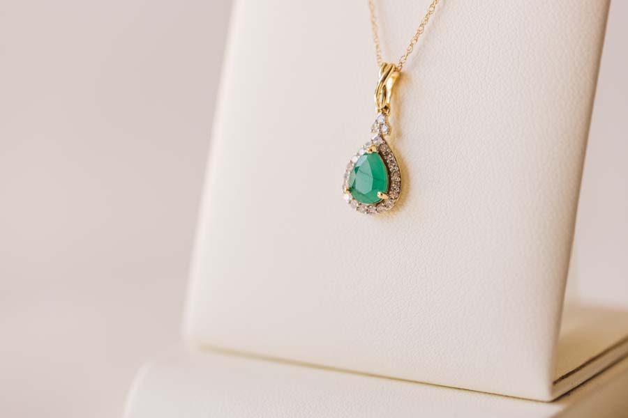 Halo Pendant with .13 Carat TW of Diamonds and 7x5MM Pear Shape Emerald in 10kt Yellow Gold with Chain