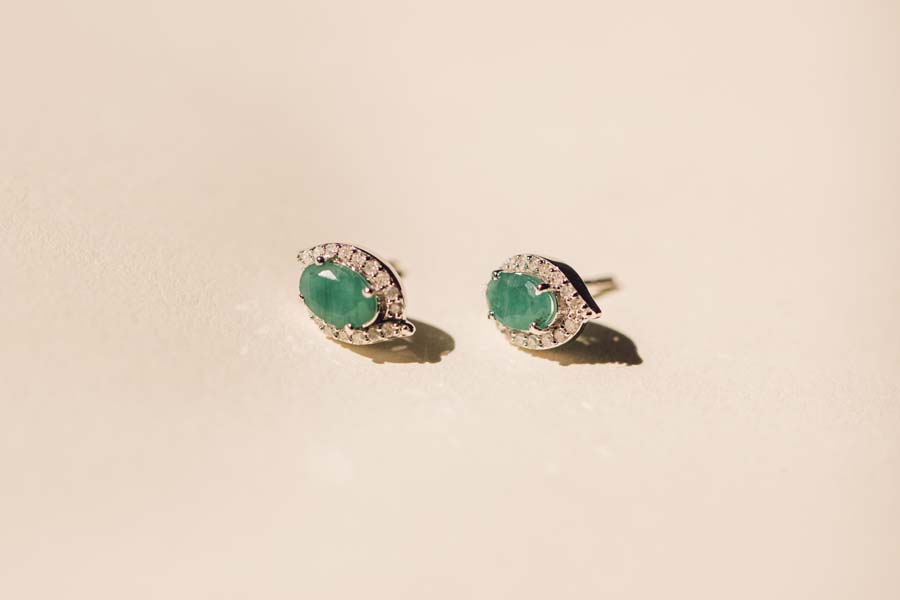Halo Earrings with .17 Carat TW of Diamonds and 6x4MM Oval Emerald in 10kt White Gold