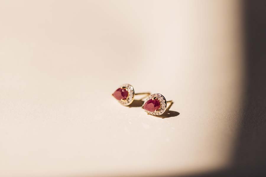 Halo Earrings with .17 Carat TW of Diamonds and 6x4MM Pear Shape Ruby in 10kt Yellow Gold