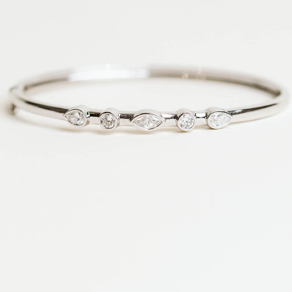Multi-Shaped Diamond Bangle with 1.25 Carat TW of Lab Created Diamonds in 14KT White Gold