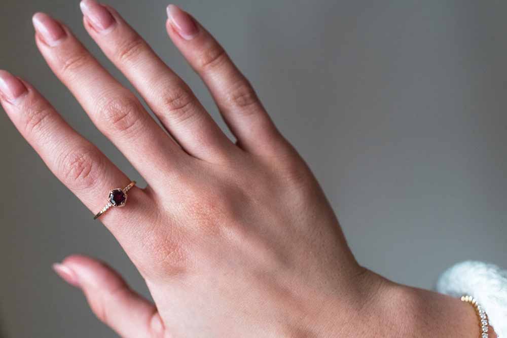Ring with 5MM Round Rhodolite Garnet and .03 Carat TW of Diamonds in 10kt Yellow Gold
