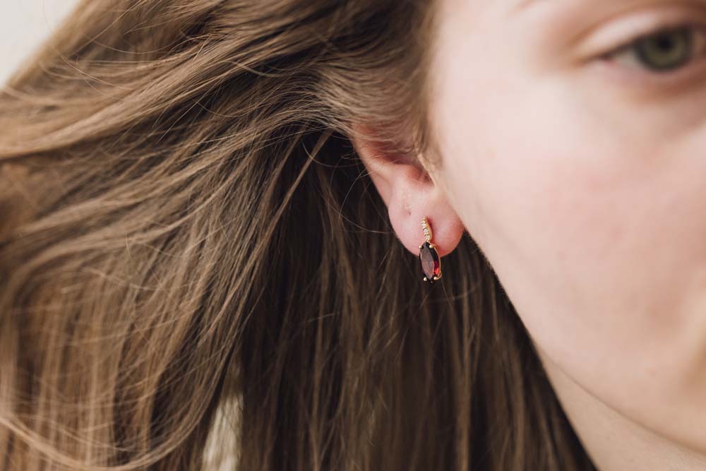 10X5MM Garnet Diamond Earrings with .03 Carat TW of Diamonds in 10kt Yellow Gold