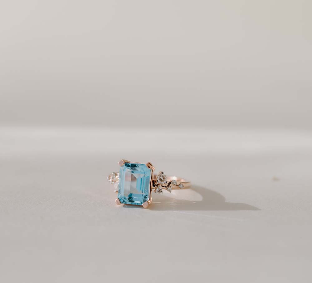 Emerald Cut Blue Topaz and Diamonds ring in 14kt Rose Gold