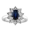 Oval Halo Ring with .18 Carat TW of Diamonds and Blue Sapphire in 10kt White Gold