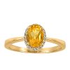 Ring with .06 Carat TW of Diamonds and Oval Citrine in 10kt Yellow Gold