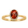 Ring with .06 Carat TW of Diamonds and Oval Garnet in 10kt Yellow Gold