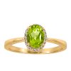 Ring with .06 Carat TW of Diamonds and Oval Peridot in 10kt Yellow Gold