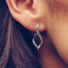 Twisted Hoop Earrings with .20 Carat TW of Diamonds in 10kt White Gold