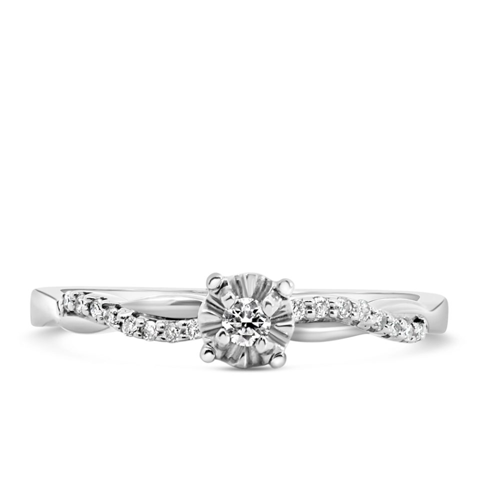 Gorgeous engagement ring adorned with sparkling diamonds totaling 0.10 carats, set in brilliant 10kt white gold