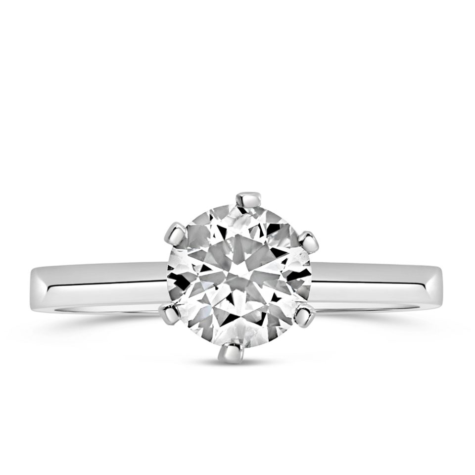 This image showcases a stunning Northern Facet Ideal Cut Solitaire Engagement Ring, crafted in 18kt White Gold and featuring a dazzling 1.00 Carat Diamond at its center