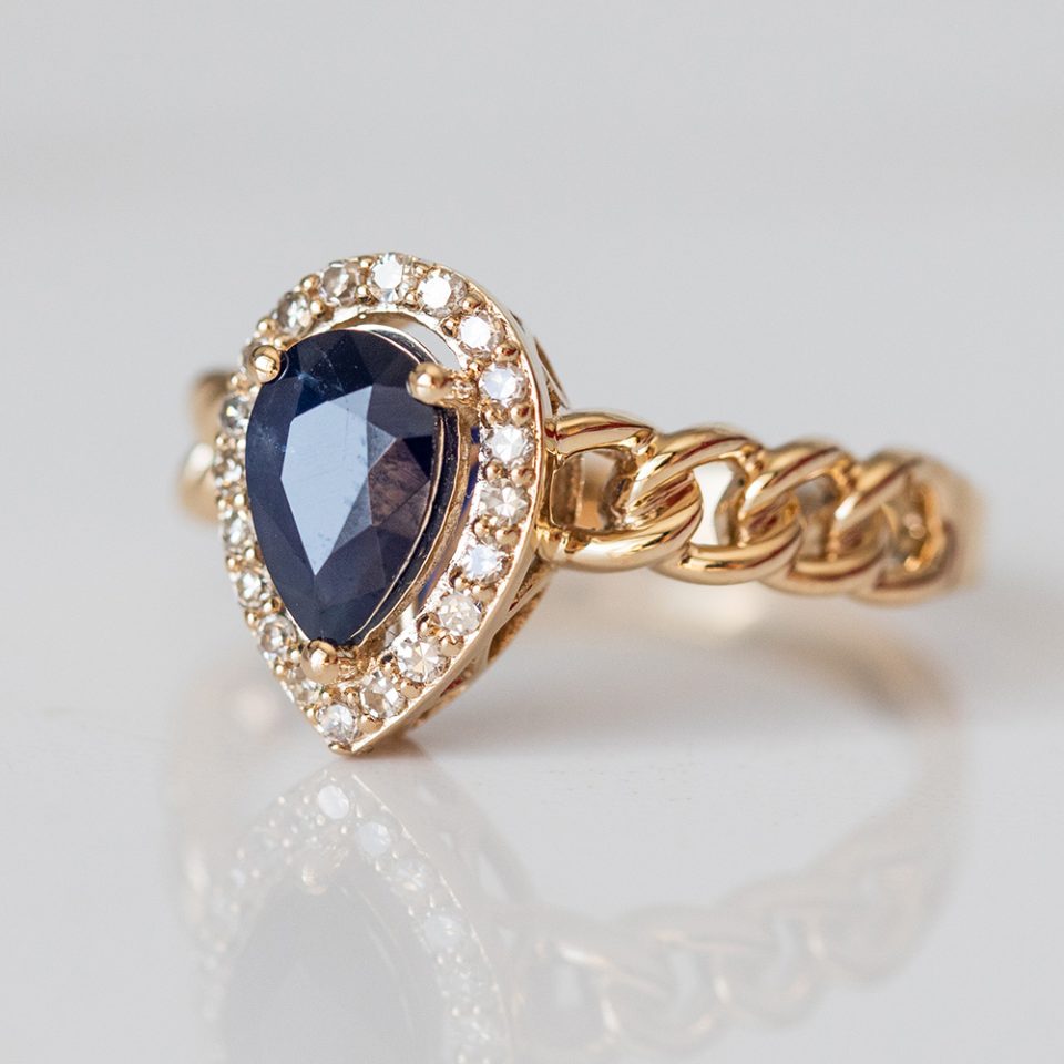 Ring with 7X5MM Pear Shape Blue Sapphire and .16 Carat TW of Diamonds in 10kt Yellow Gold