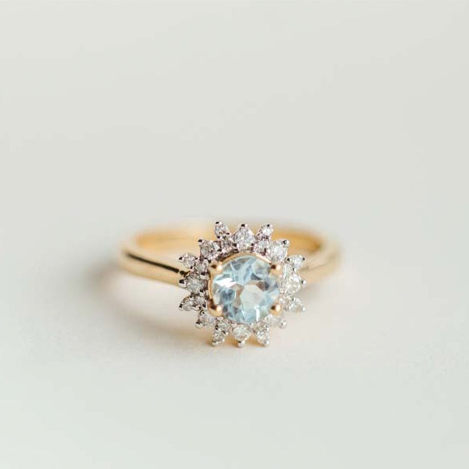 Ring With 6MM Round Aquamarine And .30 Carat TW Of Diamonds In 14kt Yellow Gold