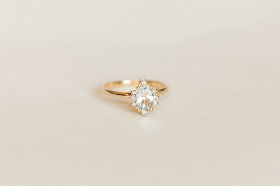 Ring 7X5MM Oval Aquamarine and .08 Carat TW Diamonds in 14kt Yellow Gold