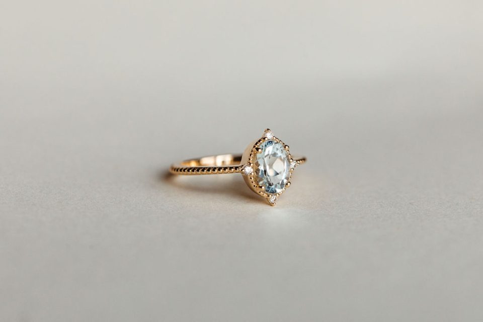Ring with 8X6MM Oval Aquamarine and .06 Carat TW Diamonds in 10kt Yellow Gold