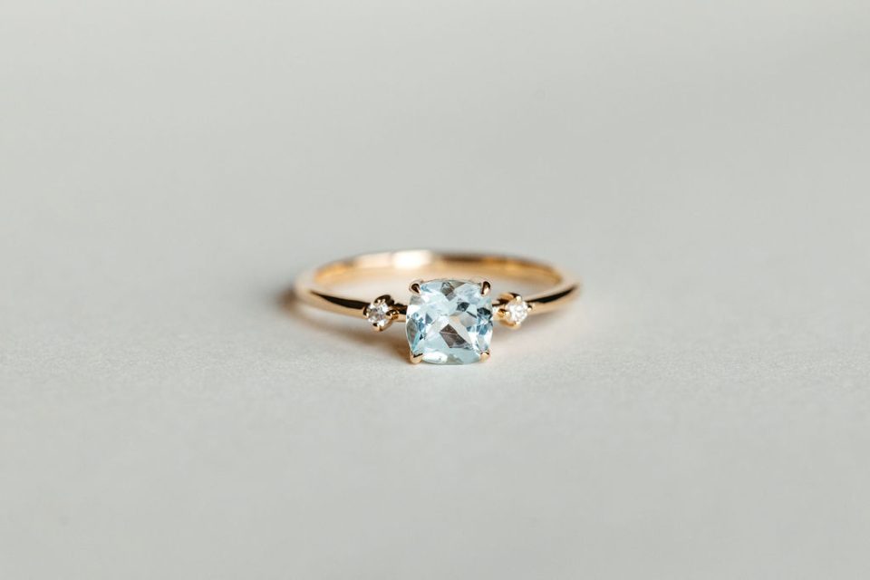 Ring with 6MM Cushion Aquamarine and .04 Carat TW Diamonds in 10kt Yellow Gold