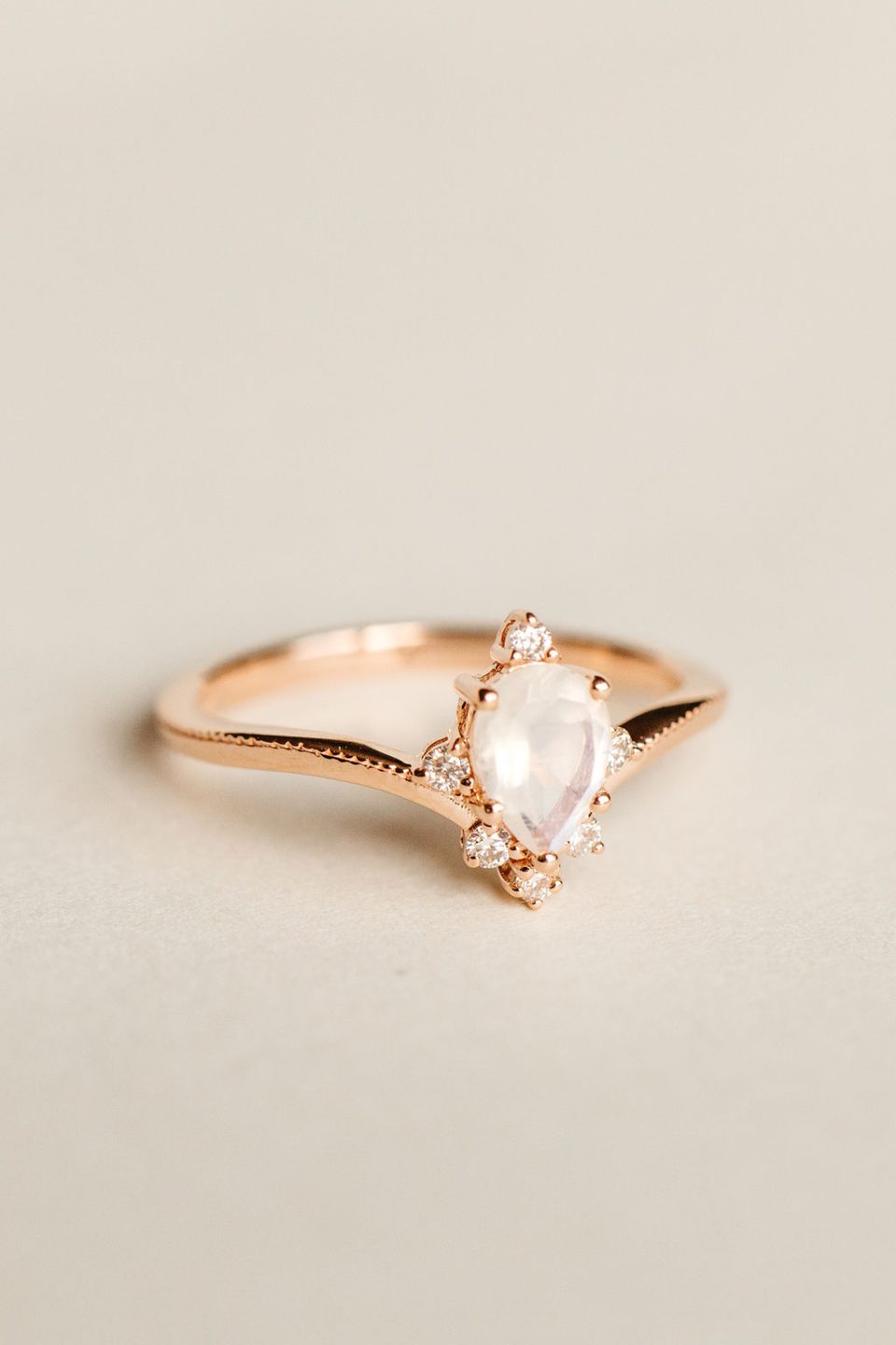 Ring with 7X5MM Pear Shape Rainbow Moonstone and .12 Carat TW Diamonds in 10kt Rose Gold