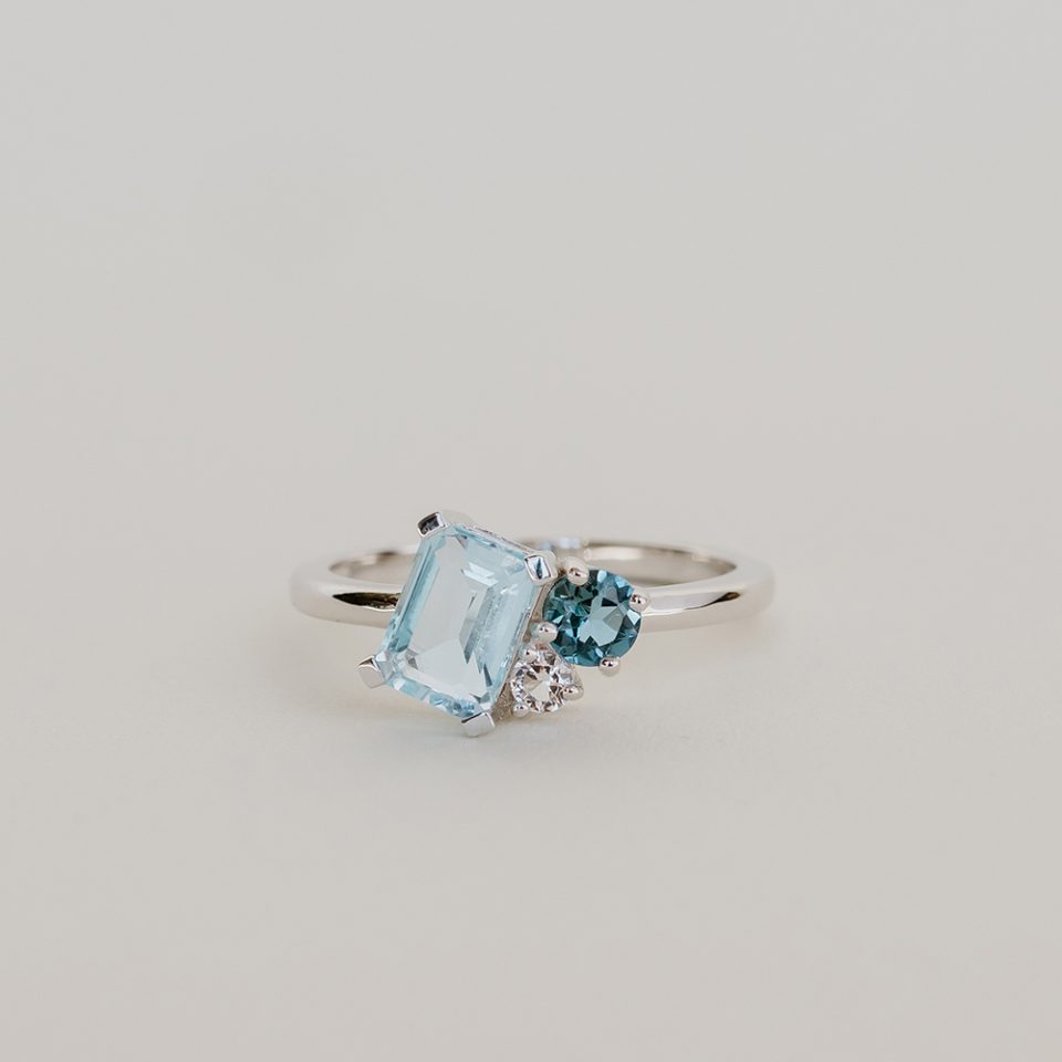 Ring with Emerald Cut Sky Blue Topaz, London Blue Topaz and White Topaz