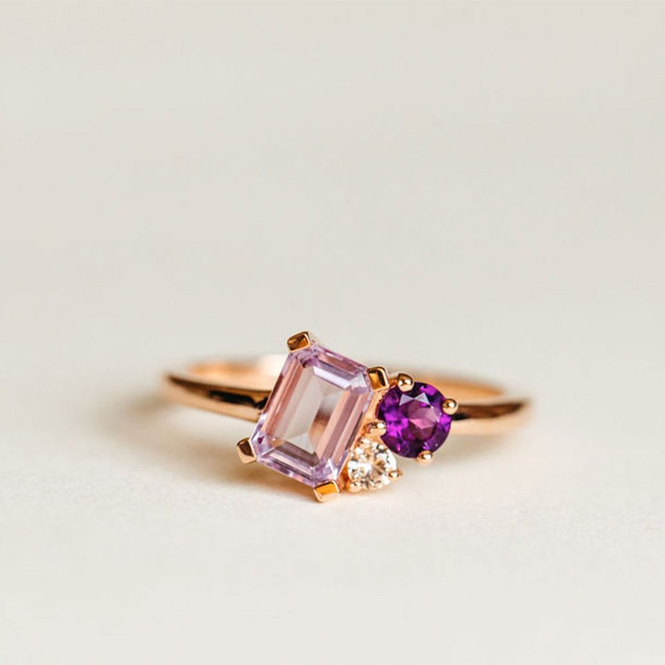 Ring With 7X5MM Emerald Cut Pink Amethyst, Amethyst And White Topaz In 10kt Rose Gold