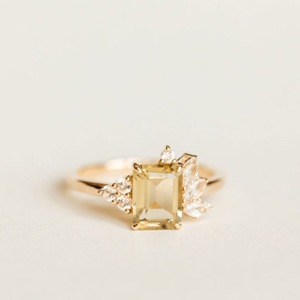 Ring With 8X6MM Emerald Cut Olive Green Quartz And White Topaz In 14kt Yellow Gold