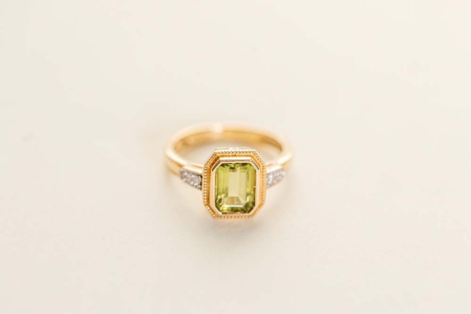 Ring with 7X5MM Octagonal Peridot and .05 Carat TW of Diamonds in 14kt Yellow Gold