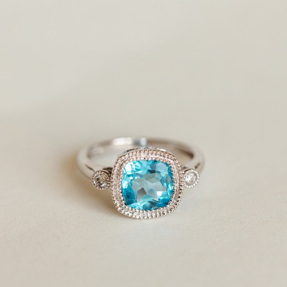 Ring With 8MM Blue Topaz And .07 Carat TW Of Diamonds In 14kt White Gold