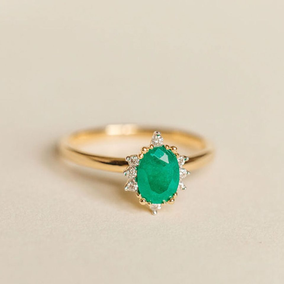 Ring With 7X5MM Emerald And .08 Carat TW Of Diamonds In 14kt Yellow Gold