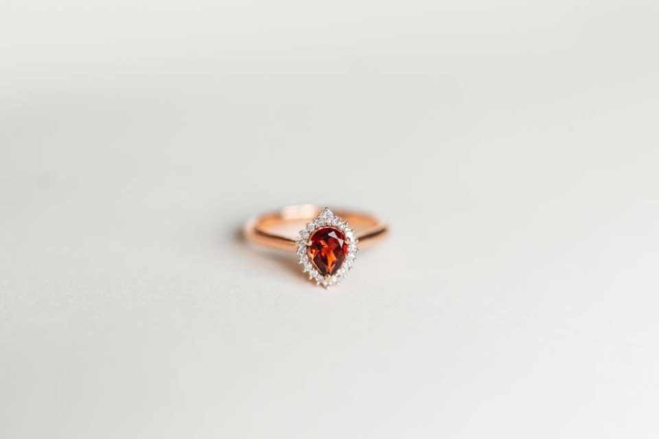Ring with 7X5MM Pear Shape Garnet and .10 Carat TW of Diamonds in 14kt Rose Gold