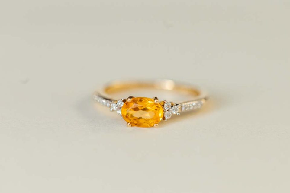 Ring with Oval 7X5MM Citrine and .10 Carat TW of Diamonds in 14kt Yellow Gold
