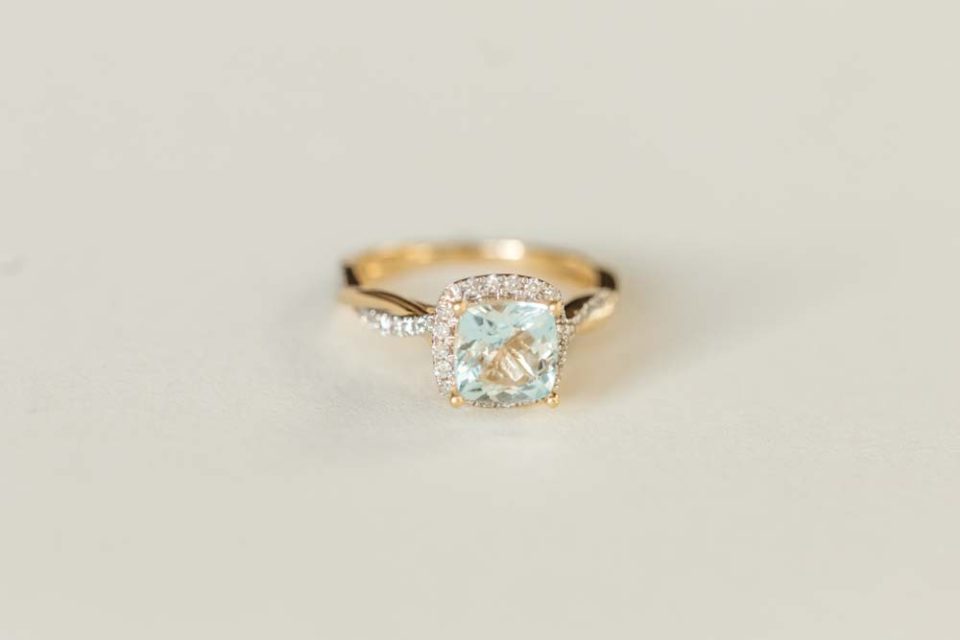 Ring with Cushion Cut 7MM Aquamarine and .30 Carat TW of Diamonds in 14kt Yellow Gold