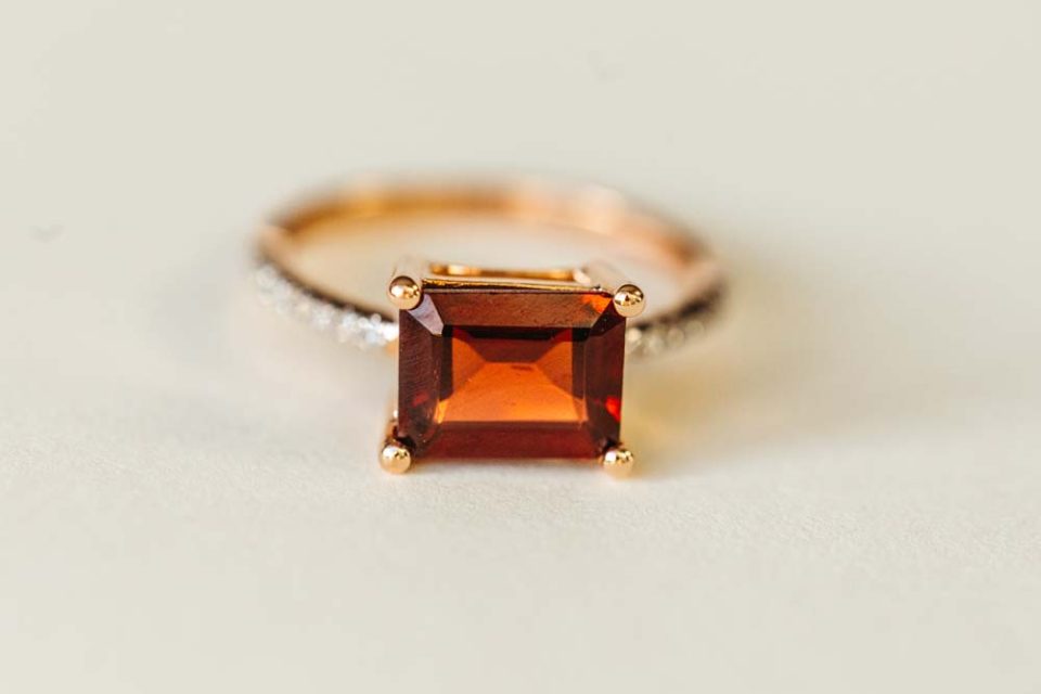 Ring with 9X7MM Emerald Cut Garnet and .12 Carat TW of Diamonds in 14kt Rose Gold