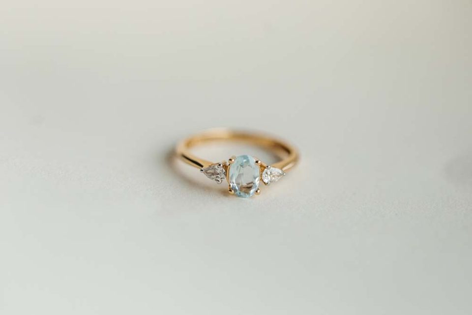 Ring with Oval 7X5MM Aquamarine and .20 Carat TW of Diamonds in 14kt Yellow Gold