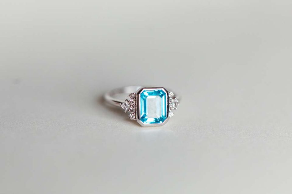 Ring with 7X5MM Octagonal Emerald Cut Blue Topaz and White Topaz in 10kt White Gold