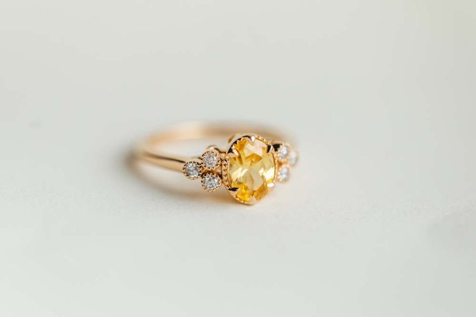 Ring with 8X6MM Oval Yellow Sapphire and .15 Carat TW of Diamonds in 14kt Yellow Gold
