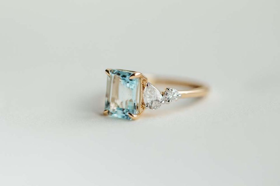 Ring with 9X7MM Emerald Cut Aquamarine and .33 Carat TW of Diamonds in 14kt Yellow Gold